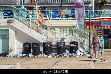 Brighton UK 31st May 2020 - Litter and bottles left behind overnight from Saturday along Brighton beach and seafront on another beautiful sunny day during the Coronavirus COVID-19 pandemic crisis  . Credit: Simon Dack / Alamy Live News Stock Photo