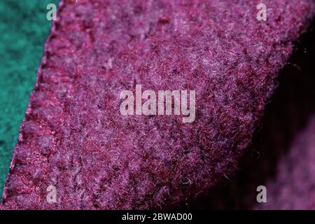 zoomed image of the texture of a fuchsia and green fabric Stock Photo