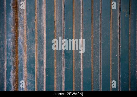 Green metal dust-covered door background. Stock Photo