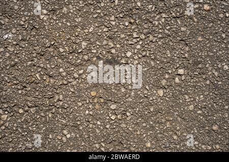 Texture of an asphalt road. Close-up background. Top view. Stock Photo