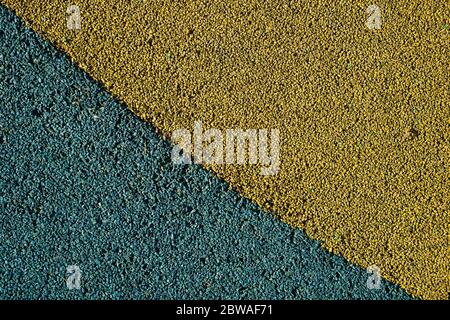 Greenish blue and yellow painted tiny stones texture. Gravel background. Stock Photo