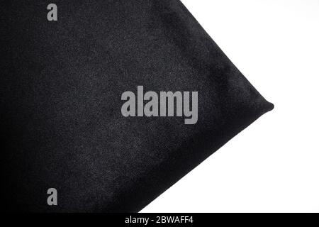Close-up of black color velvet texture on a white background. Dark triangle. Top view. Stock Photo