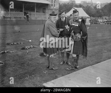 At the Northern Games meeting at Inverness , Scotland . Brigadier General Ross and the Mackintosh of Mackintosh chatting to a piper . Stock Photo