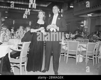 At the Golf Ball held at Grosvenor House , London , in aid of the St Mary ' s Hospital Extension Appeal Fund ; Miss Kathleen Stammers and Mr Critchley . 1938 Stock Photo