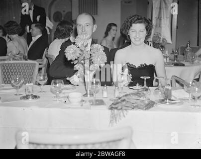 At the Golf Ball held at Grosvenor House , London , in aid of the St Mary ' s Hospital Extension Appeal Fund , the soon to be engaged , Commander Wylie and Miss Phyllis Wade . 1938 Stock Photo