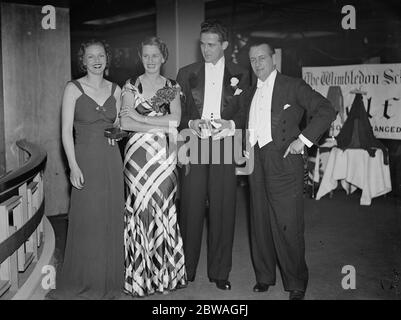 At the Golf Ball held at Grosvenor House , London , in aid of St Mary ' s Hospital , from left to right ; Mrs Dale Bourne , Mrs G Carbutt , Mr R Sweeney and Mr G Carbutt . 1937 Stock Photo