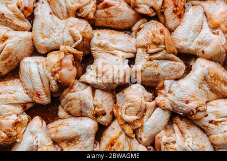 Raw Marinated chicken meat wings in a marinade.Cooking chicken with spices in the oven. Flat lay. Close up Stock Photo