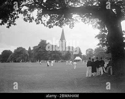 Southborough Church formed a picturesque background to an old time cricket match in which players wore top hats 7 September 1932 Stock Photo