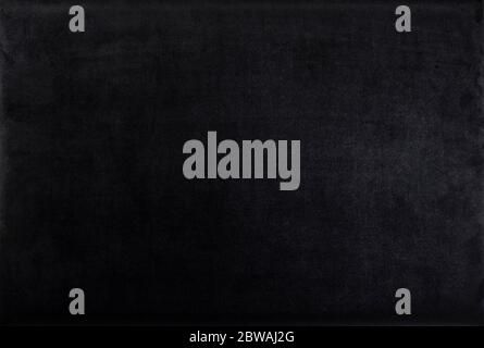 Black color velvet texture. Dark background. Top view. Stock Photo