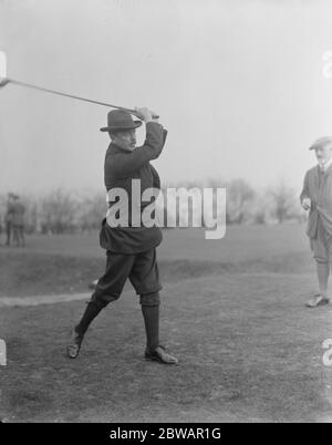 Golf at Northwood House of Commons versus Sandy Lodge CLub Sir L Worthington Evans ( H of C ) driving 28 February 1920 Stock Photo