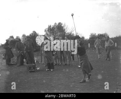 Parliamentary Golf match at Walton Heath Lady Nancy Astor drives off. 1938 Stock Photo