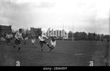 The Old Merchant Taylors versus London Irish rugby match at Teddington . ( The last match on the former 's present ground , next season they change to Croxley Green ) . J D Gibbon ( OMT ) and J M Thomson ( London Irish ) in a tackle . 10 April 1937 Stock Photo