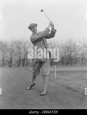 Golf at Northwood House of Commons versus Sandy Lodge CLub Captain Angus versus Hambro ( H of C ) driving 28 February 1920 Stock Photo