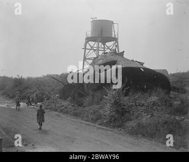 Coal from war wrecked coalfield of Lens . A new water tower and the old . In the background is seen some of the army huts now used by the French miners . 23 September 1920 Stock Photo