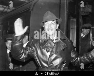 At Waterloo Station on returning to the USA , Mr Robert Taylor , the American film star . 8 December 1937 Stock Photo