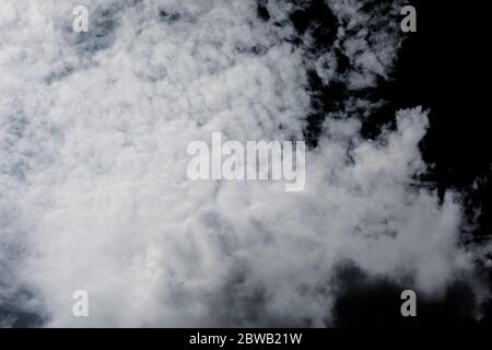 White clouds on isolated black sky. Panorama view background or overlay elements for design projects Stock Photo