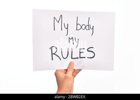 Cardboard banner with MY BODY MY RULES asking for body rights over isolated white background Stock Photo