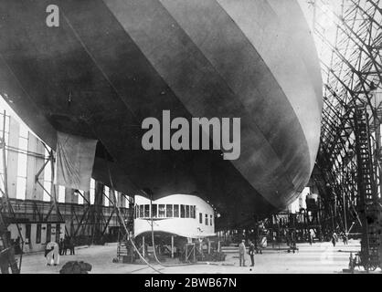 First photos of Zeppelin which will attempt to cross the Atlantic . Photo shows the complete ZR3 , the giant commercial zeppelin built for America at Friedrichshafen . This zeppelin which is constructed along semi - rigid lines will be used for commercial purposes . It is fitted with twenty sleeping compartments and has facilities for cooking and a heating plant for the comfort of the passengers . 26 August 1924 Stock Photo