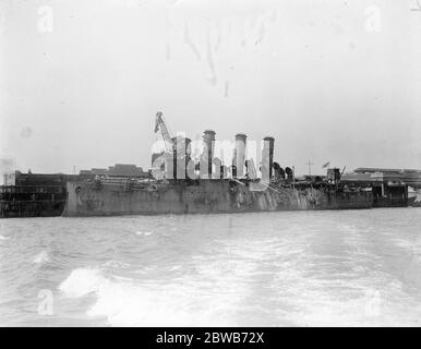 The Great Naval raid on Zeebrugge . HMS Vindictive a British protected cruiser . On 23 April 1918 she was in fierce action at Zeebrugge when she went alongside the Mole and her upperworks were badly damaged. The badly damaged HMS Vindictive seen here on her return . 1918 Stock Photo