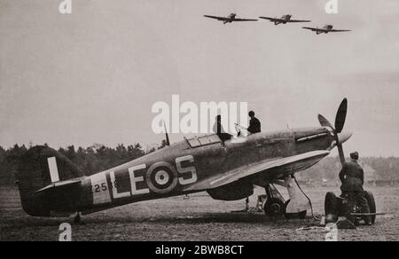 Hawker Hurricanes on, and flying over an RAF airfield during the Battle of Britain. The British single-seat fighter aircraft was designed and predominantly built by Hawker Aircraft Ltd for service with the Royal Air Force (RAF). It was overshadowed in the public consciousness by the Supermarine Spitfire's role during the Battle of Britain in 1940, but the Hurricane inflicted 60 per cent of the losses sustained by the Luftwaffe in the engagement. Stock Photo