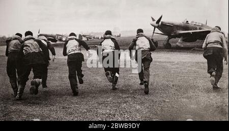 RAF pilots scramble to their Hawker Hurricanes during the Battle of Britain. The British single-seat fighter aircraft was designed and predominantly built by Hawker Aircraft Ltd for service with the Royal Air Force (RAF). It was overshadowed in the public consciousness by the Supermarine Spitfire's role during the Battle of Britain in 1940, but the Hurricane inflicted 60 per cent of the losses sustained by the Luftwaffe in the engagement. Stock Photo