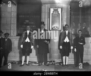 The Mayor of Westminster ( Mayor V B Rogers ) at the re opening of London ' s shortest street Savoy Court , strand . Its pavements are sheltered on both sides by steel and glass awnings lighted from underneath and bears plaques relating its history on the walls Typical men servants of Savoy Hotel and Pageboy 31st October 1929 Stock Photo