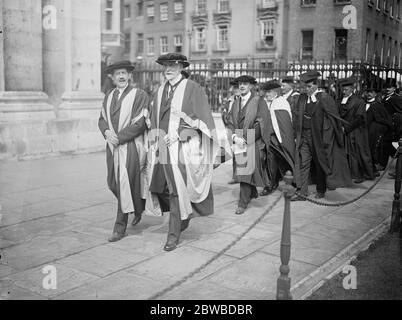 Honoury Degrees conferred at Cambridge . Honorary degrees were conferred at Cambridge University in connection with the ceremonial opening of the Marley extension to the Fitzwilliam museum . The procession to the Senate House . The Duke of Rutland on the right , next to him is Earl Crawford . Behind Lord Crawford is Sir Charles John Holmes . 18 June 1924 Stock Photo