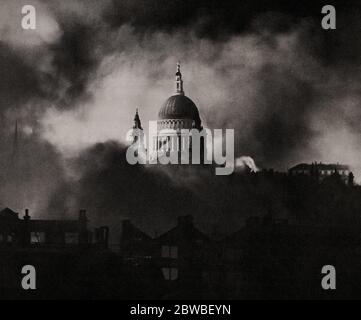 During the Blitz German bombing campaign against the United Kingdom in 1940 and 1941, during the Second World War, the dome of St Paul's Cathedral is seen through the smoke of an air raid, Somehow, it was spared the Luftwaffe's bombs. Stock Photo