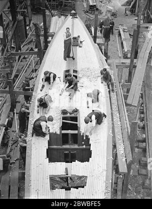 In a Yacht building yard Work at Camper and Nicholson ' s yard , Gosport on Mr T O Sopwith ' s new yacht ' Tomahawk ' 23 May 1939 Stock Photo