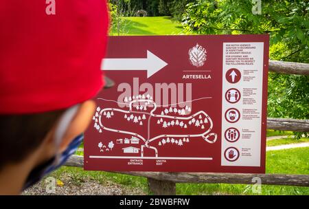 Sign indicating mountain routes and touristic information in the Arte Natura route - Arte Sella - the park with many artworks - Borgo Valsugna -Italy Stock Photo