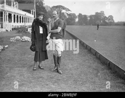 Polo at the Ranelagh Club , West London . At the match between the , Royal Horse Artillery Subalterns versus Foston Hall in the Junior Colts Cup tie , Mr RB Daniell and Mrs Daniell . 28 May 1934 Stock Photo