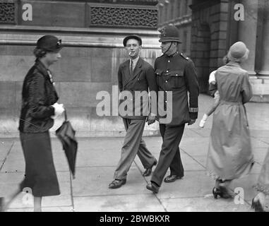 ' All power to the greenshirts ' The slogan written on a brick , painted green and flung by ( Micheal Murphy , seen in custody here ) , being flung through a window of Number 10 Downing street during a cabinet meeting 27 June 1934 Stock Photo