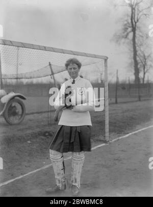 Ladies Hockey East versus South  A  ' Territorial ' Ladies hockey match was played at Kew on Thursday  Miss Higgins the South goalkeeper with her black cat mascot  23 February 1922 Stock Photo