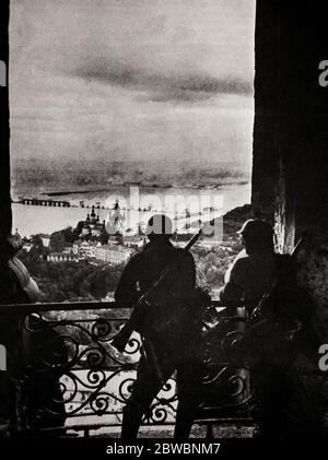 German troops look down on the River Dneiper as it flows through Kiev. The Battle of the Dnieper was a military campaign that took place in 1943 on the Eastern Front of World War II. It was one of the largest operations in World War II, involving almost 4,000,000 troops at a time stretched on a 1,400 kilometres (870 mi) long front. During its four-month duration, the eastern bank of the Dnieper was recovered from German forces by five of the Red Army's fronts. Subsequently, Kiev was liberated in the Battle of Kiev. Stock Photo