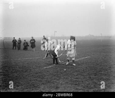 London University versus Paris University ladies hockey match at Mitcham . A duel for possession in front of the French goal . 21 February 1925 Stock Photo