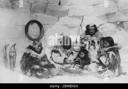 Remarkable exploits of a woman hunter . During a hunting expedition on the North Siberian Coast , about 1000 miles from the North Pole , in bleak country that had only been traversed by two white men before them , Mr and Mrs Kleinschmidt , of New York , had many thrilling experiences . Mrs Kleinschmidt ( 2nd from right ) at an Eskimo crab dinner party . 25 October 1924 Stock Photo