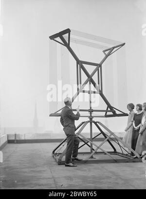 The world ' s largest frame aerial is the highest in England This frame aerial on Bush House , London , is not only believed to be the largest in the world but it is the highest in England . It enables enormous ranges to be accomplshed , a wireless expert is seen explaining the features of the aerial , which is the property of the United States shipping board 16 October 1924 Stock Photo