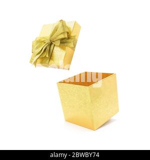 Open glod gift box with ribbon isolated on white background. Stock Photo