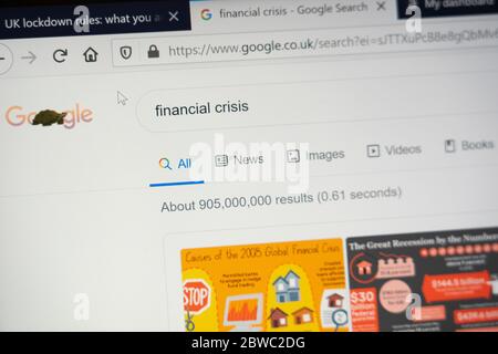 A computer screen showing the words 'Financial Crisis' as a Google search engine search term with the number of search results shown Stock Photo