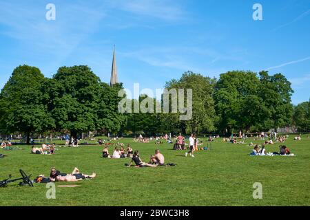Crowds of sunbathers in Clissold Park, Stoke Newington, North London during the lockdown, in May 2020 Stock Photo
