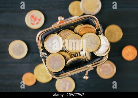 Euro coins in a wallet, top view. concept of small money, the financial crisis, the consequences of quarantine Covid-19 Stock Photo