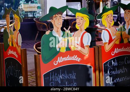 Advertisement in front of a restaurant in Düsseldorf Old Town, which is a popular tourist area with many restaurants and bars located near Rhine river. Stock Photo