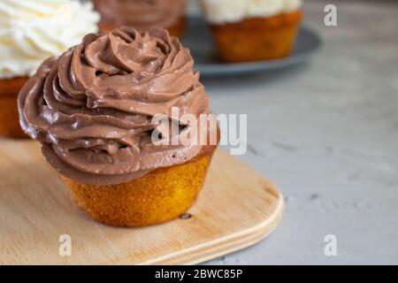 No gluten cupcakes on wooden board, vertical image. Stock Photo