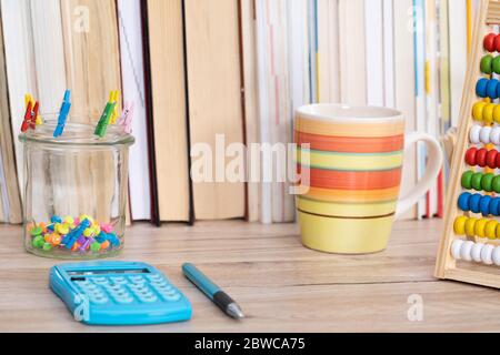 Traditional abacus for children. Electronic calculator for quick counting. Stock Photo