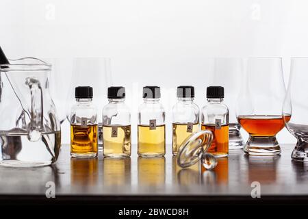 tasting bottles and glasses of whisky spirit brandy cognac. tasting at home Stock Photo