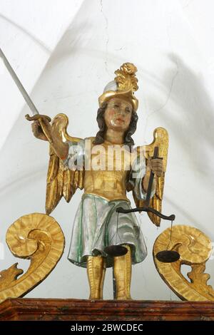 St. Michael the Archangel, statue on the high altar in the parish church of St. Peter in Saint Peter Mreznicki, Croatia Stock Photo