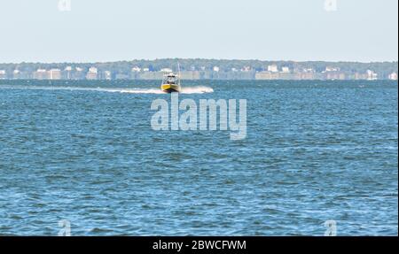 Head on view of a power boat in the Peconic River, Southold, NY Stock Photo