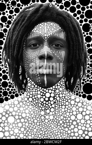 Portrait of young african man with dreadlocks and traditional face paint looking straight into the camera Stock Photo