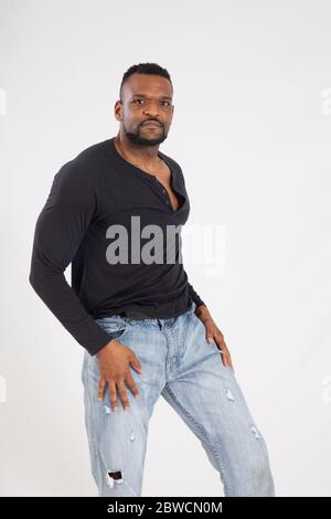 Pensive Black man in a black shrit Stock Photo