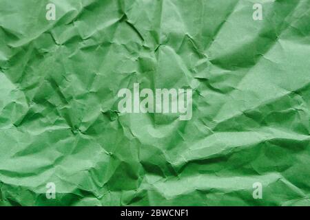Crumpled green paper, empty abstract background, copy space Stock Photo